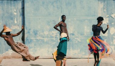 a photo of people dancing against a robins egg blue wall
