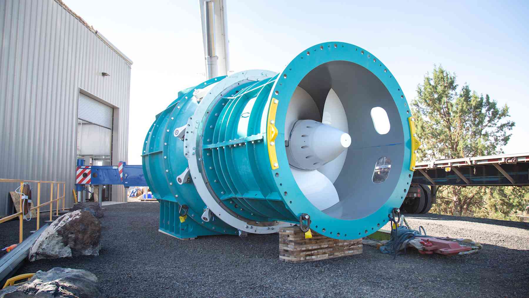 Tidal turbine testing platform lifting a turbine from the Cape Cod Canal, steel platform stands