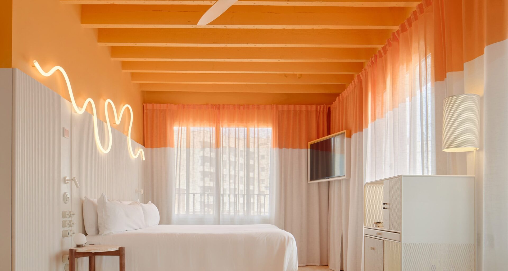 OHLAB experiments with colour-blocking and cork in old and new buildings of Terreno Barrio Hotel in Mallorca