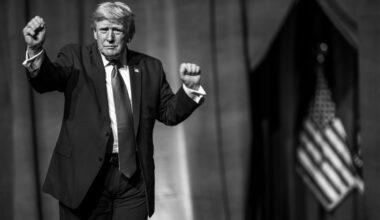 Donald Trump is doing his signature dance while on stage.