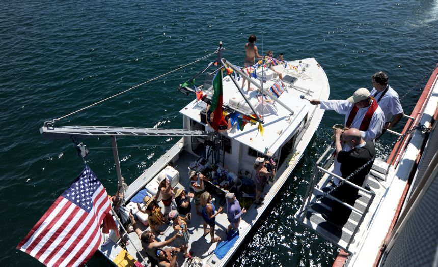 Packard's boat, the Ja'n J (seen here being blessed with holy water in 2022), is named for his two sons, Jacob and Josiah.