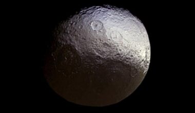This image taken by the Cassini spacecraft shows what the two-tone surface of the moon Iapetus looks like without false color.