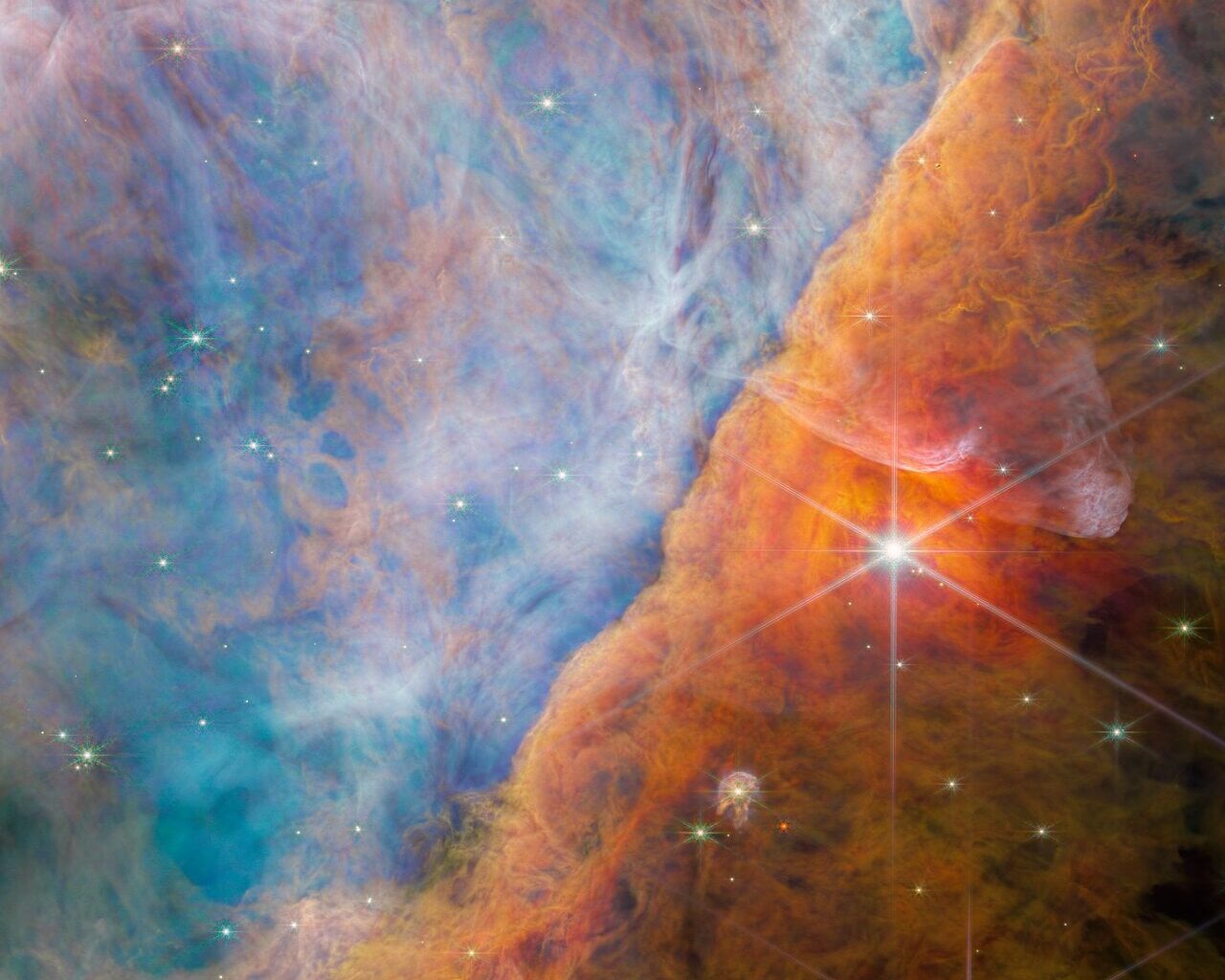 This is the Orion Bar, a ridge-like gas and dust feature in the Orion Nebula. Photochemistry is active in this region, where the light from young stars dominates. Astronomers are studying this region to understand the details of stellar feedback. Image Credit: ESA/Webb, NASA, CSA, M. Zamani (ESA/Webb), the PDRs4All ERS Team
