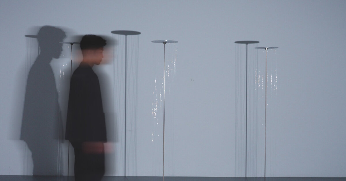 kinetic thread column transforms human presence into shifting shadows