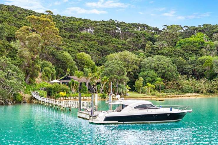 A five-bedroom bach at 3 Elizabeth Point Road is one of Kawau Island's flashiest homes and comes with access to a helipad. Photo / Supplied