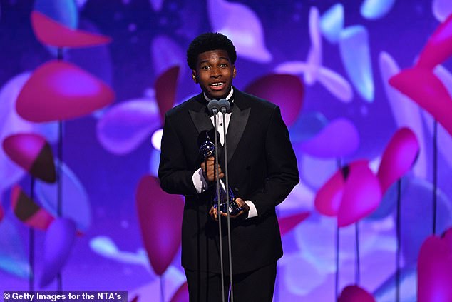 The 15-year-old was not in attendance at the ceremony due to working in the States, but his friend and Adolescence co-star Amari Bacchus was on hand to accept the award on his behalf (seen)