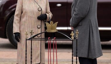 Queen Elizabeth II talks with Hugo Vickers outside of Buckingham Palace in 2012