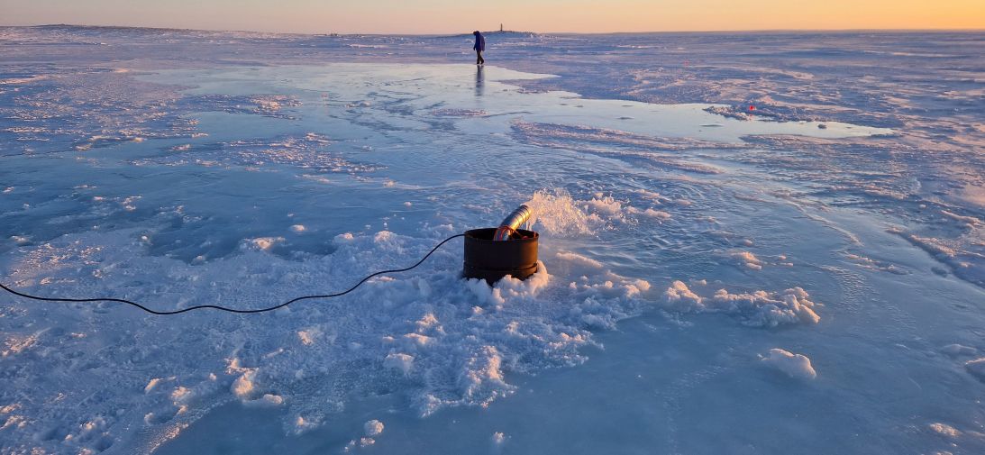 A trial run by the startup Real Ice pumps seawater over the ice in Cambridge Bay, Canada, on January 23, 2024. The aim is to thicken and restore disappearing Arctic sea ice.