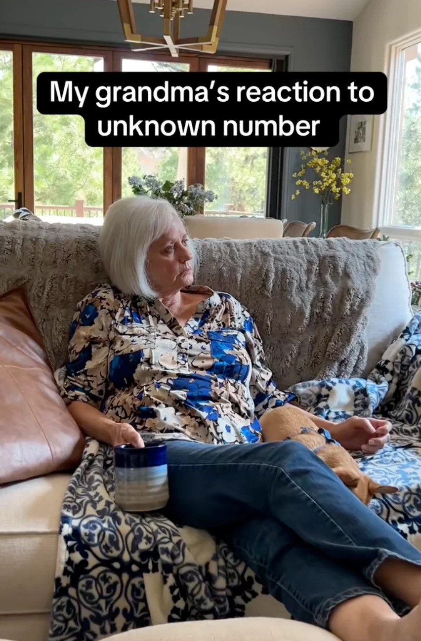Older woman sitting on a couch with a phone, appearing thoughtful. Text reads: "My grandma's reaction to unknown number."