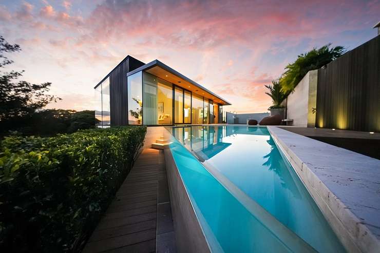 Alex and Corban Walls's trophy home on Island Bay Road, in Beach Haven, Auckland, sold under the hammer today after strong biddding. Photo / Supplied