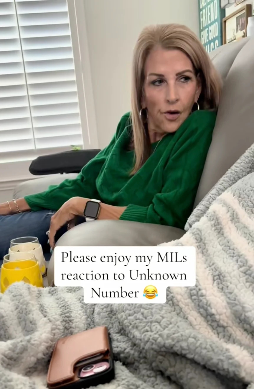 A woman in a green sweater reacts while sitting on a couch. Caption: "Please enjoy my MIL's reaction to Unknown Number ?"