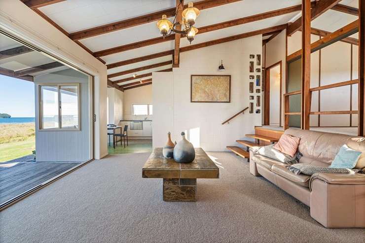 A vintage waterfront bach on Beverley Terrace has sold under the hammer for a record breaking $8.5m. Photo / Supplied