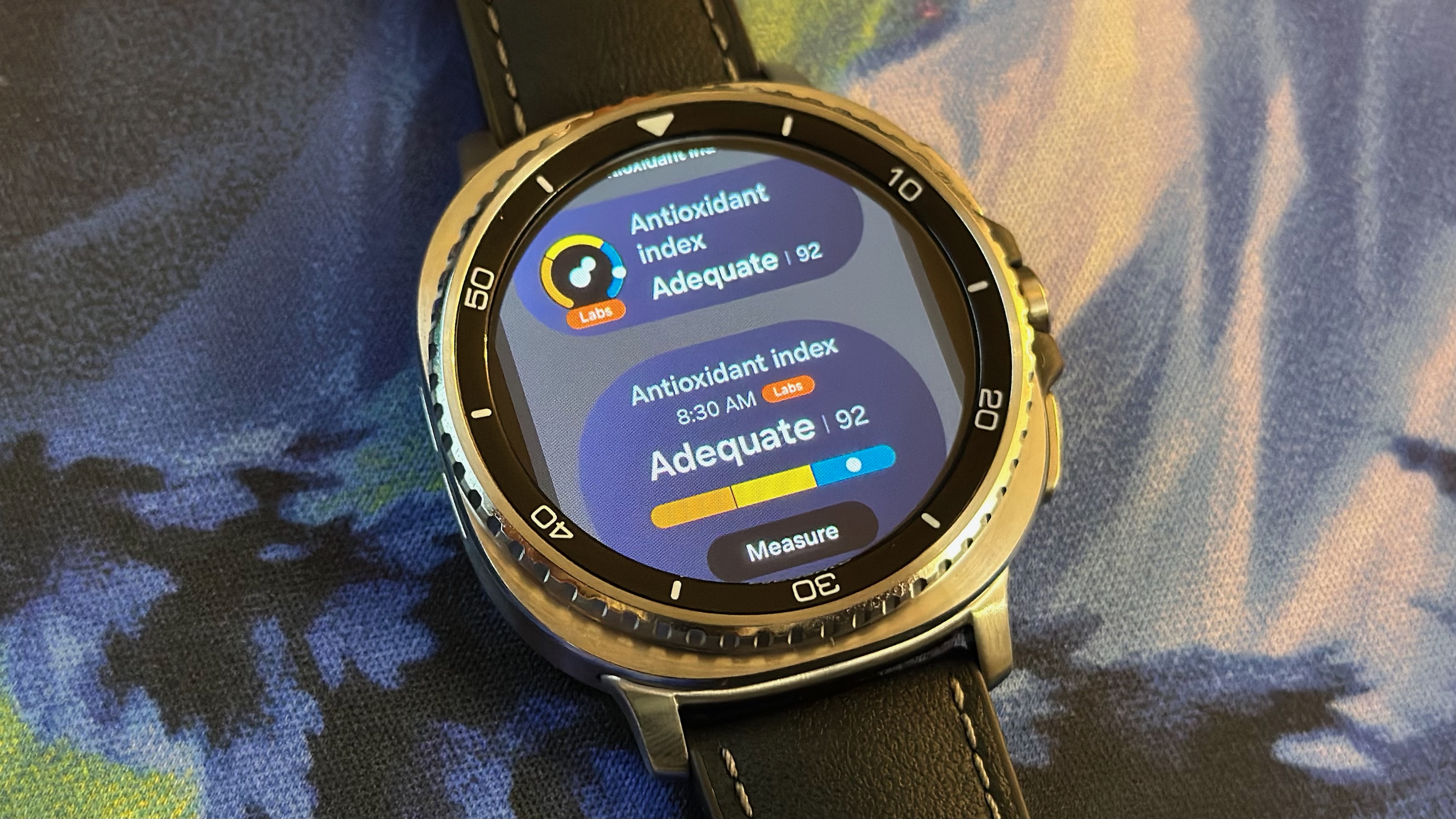 The "Add Tile" view on the Samsung Galaxy Watch 8 Classic showing two sizes of Antioxidant Index widget.