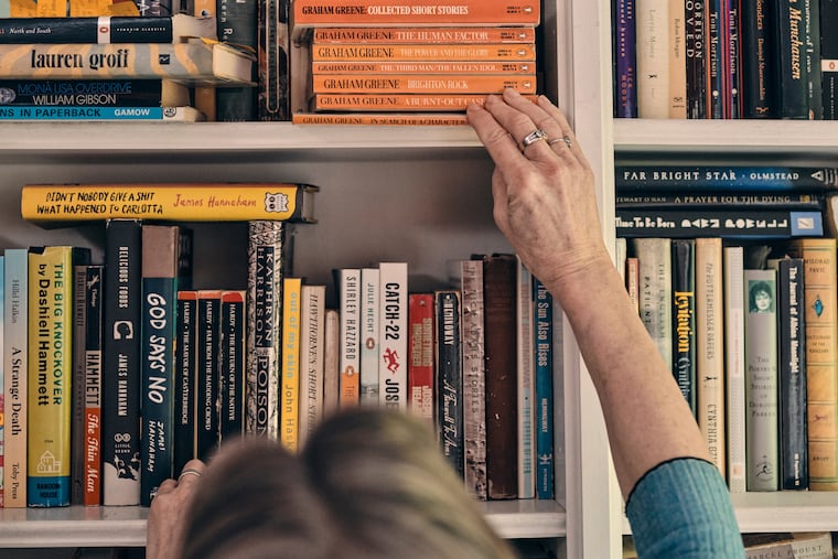 A stack of Graham Greene on Jennifer Egan's bookshelves. MUST CREDIT: Photo for The Washington Post by Christopher Gregory-Rivera