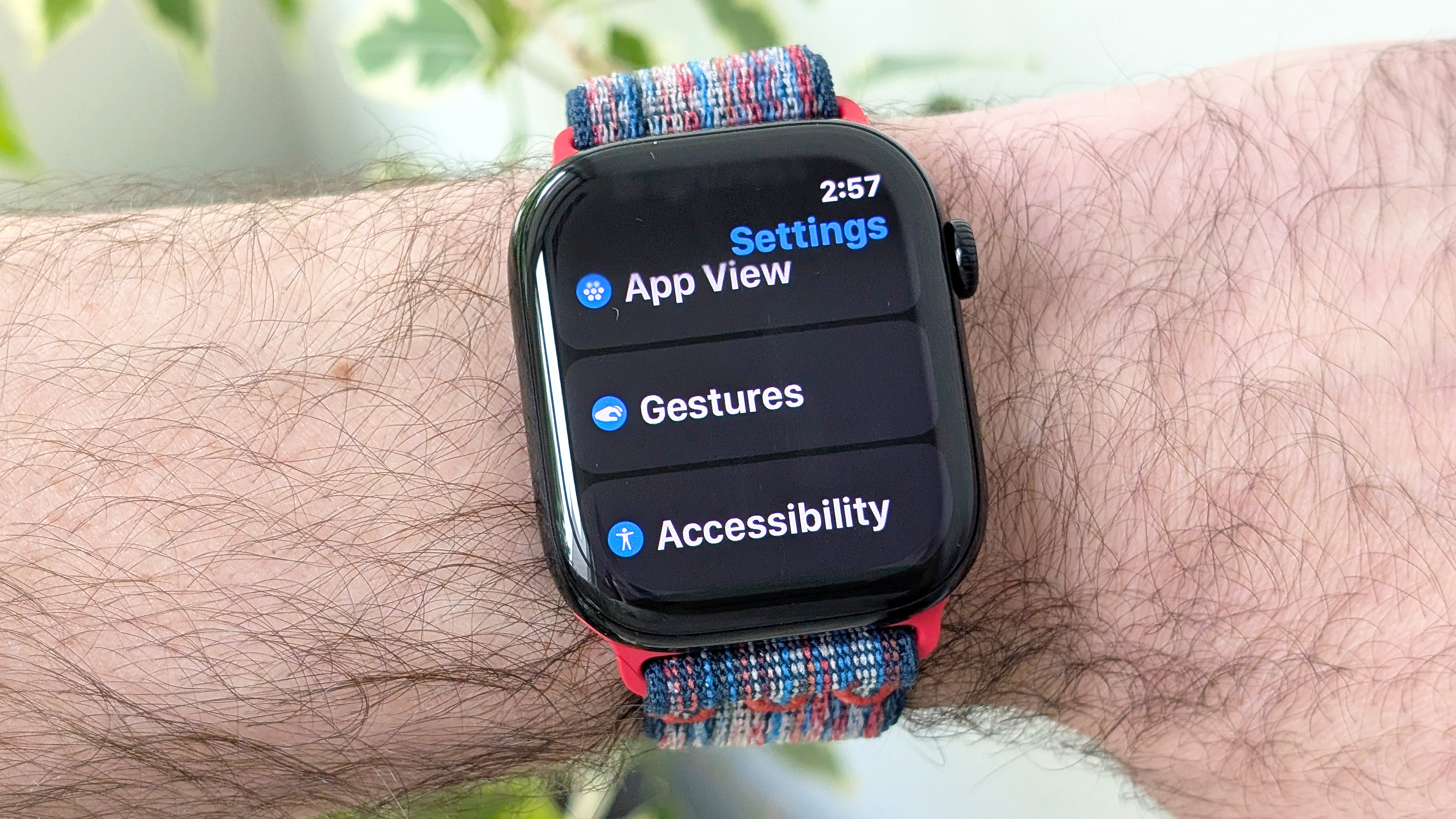 Close-up of the Apple Watch Series 10 on a user's wrist showing the new wrist flick gesture used to dismiss notifications hands free