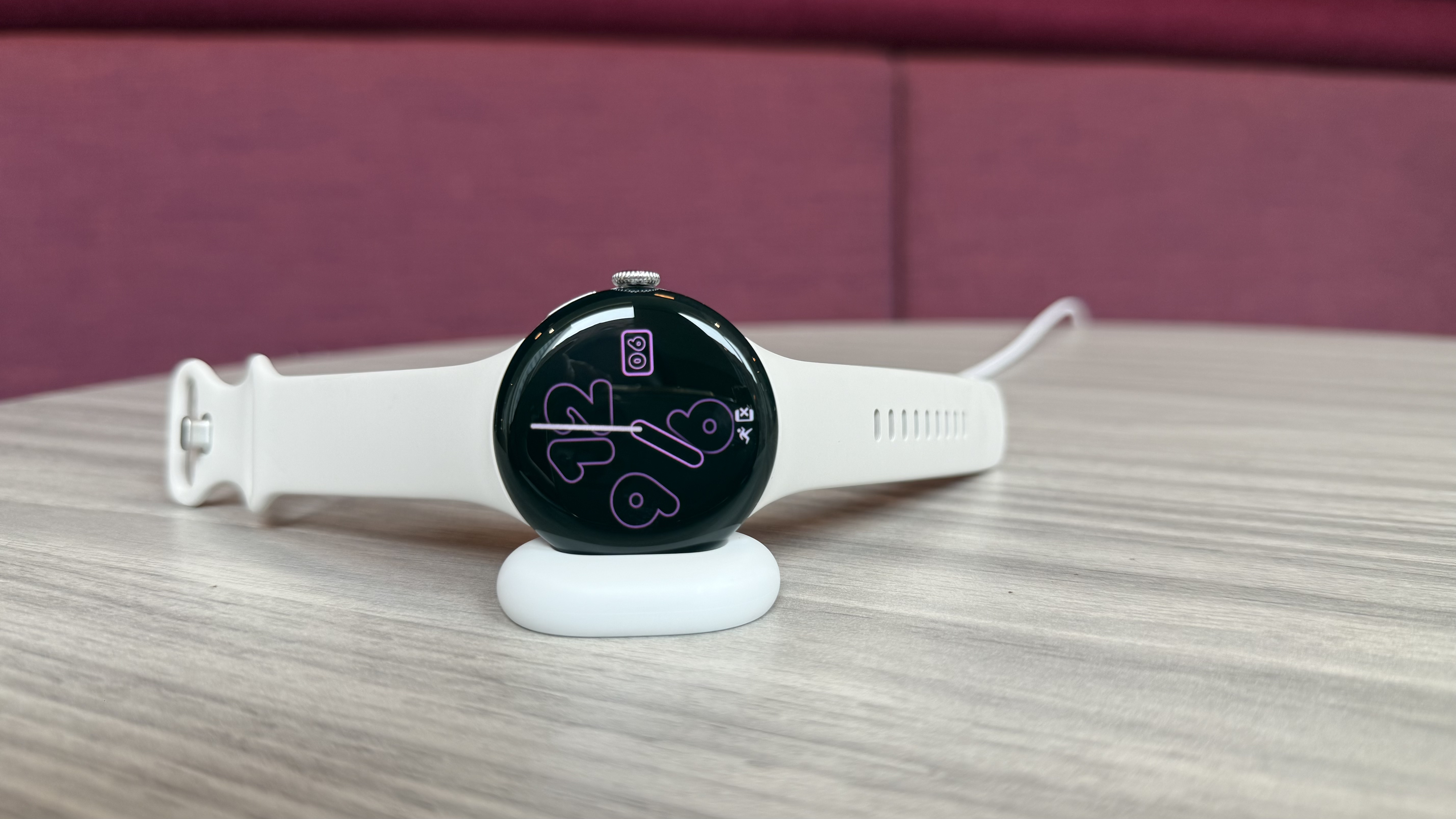 Pixel Watch on the side mounted charger