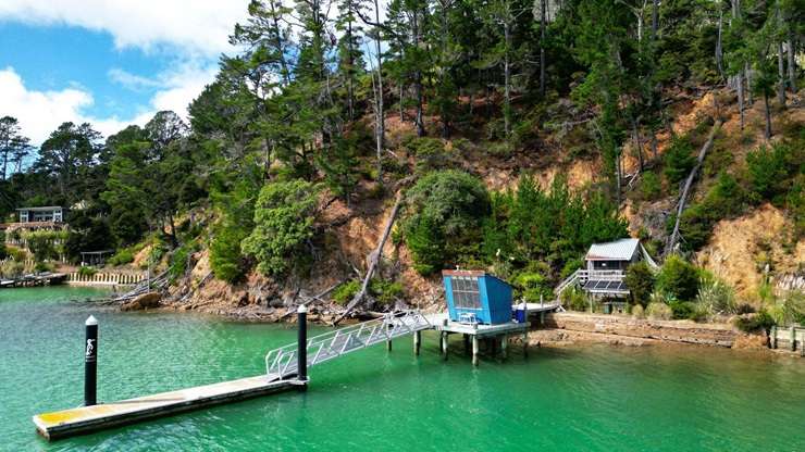 A five-bedroom bach at 3 Elizabeth Point Road is one of Kawau Island's flashiest homes and comes with access to a helipad. Photo / Supplied