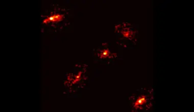 Rare Einstein cross with extra image reveals hidden dark matter