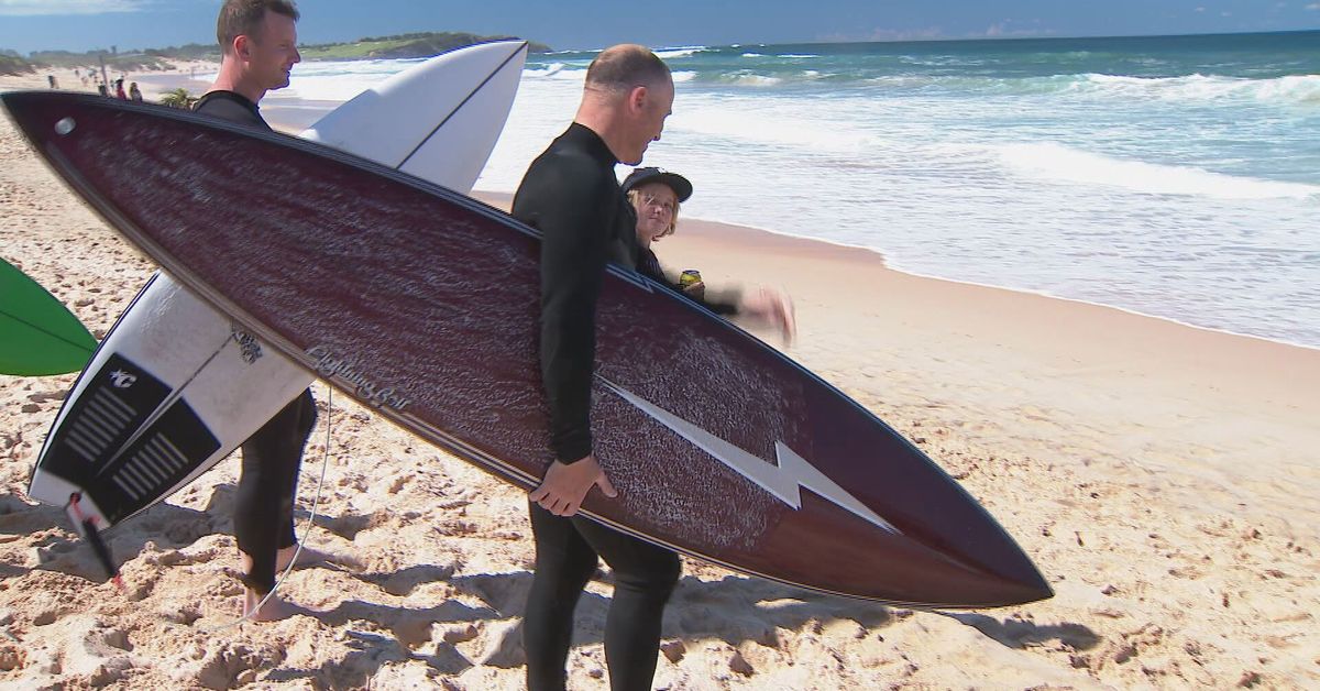 Friends of shark attack victim return to the water to 'confront' fear