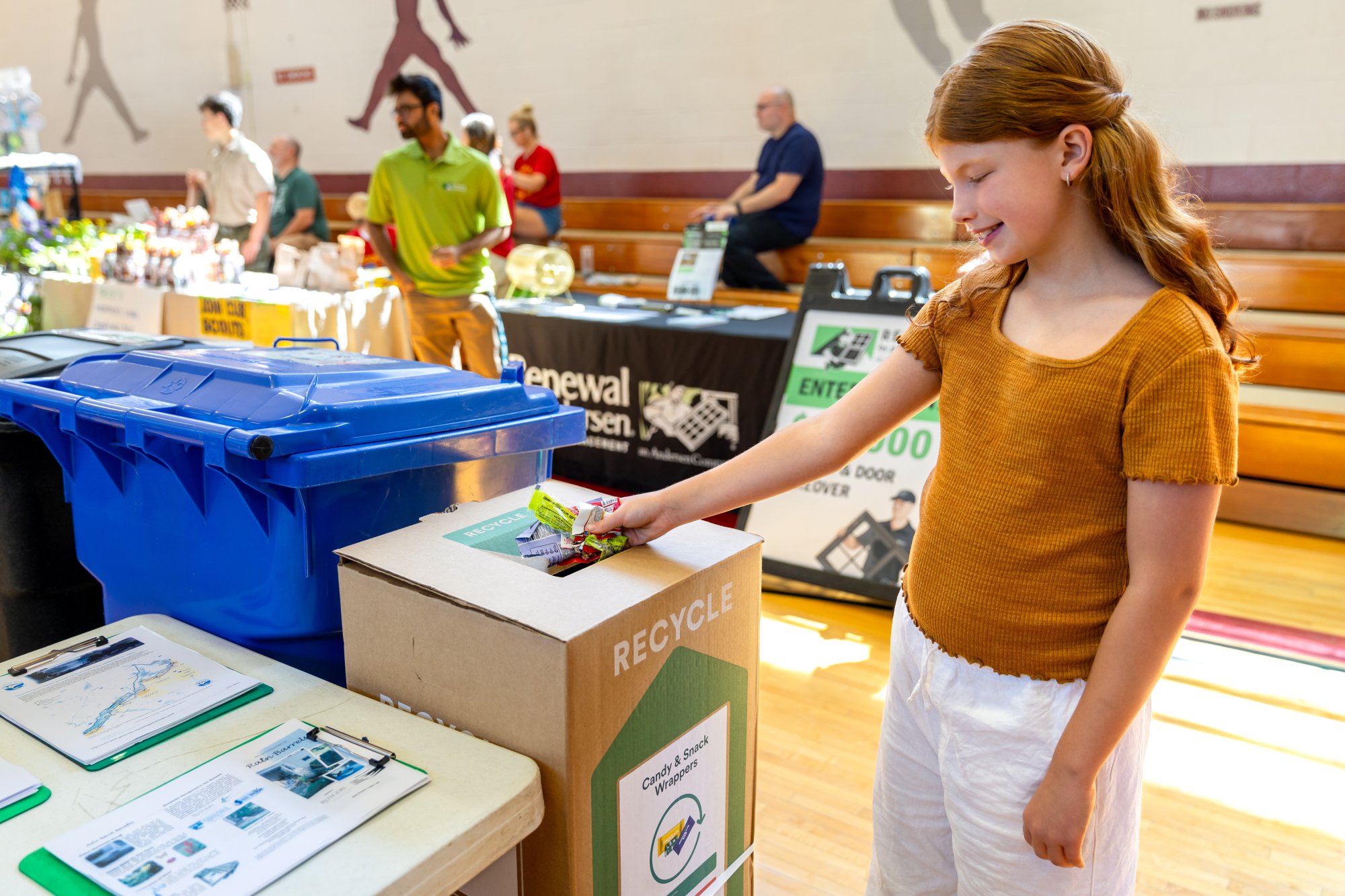 Child puts snack wrapper in TerraCycle Zero Waste Box