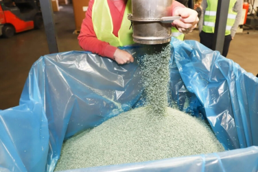Plastic pellet coming out of machine at TerraCycle recycling center