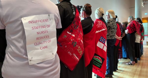 Nurses turn backs on Health Minister