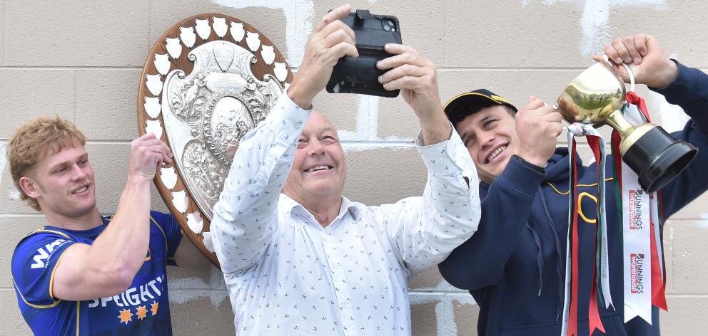 South Otago mayor Bryan Cadogan takes a selfie with players Finn Hurley (left) and Jake Te Hiwi....