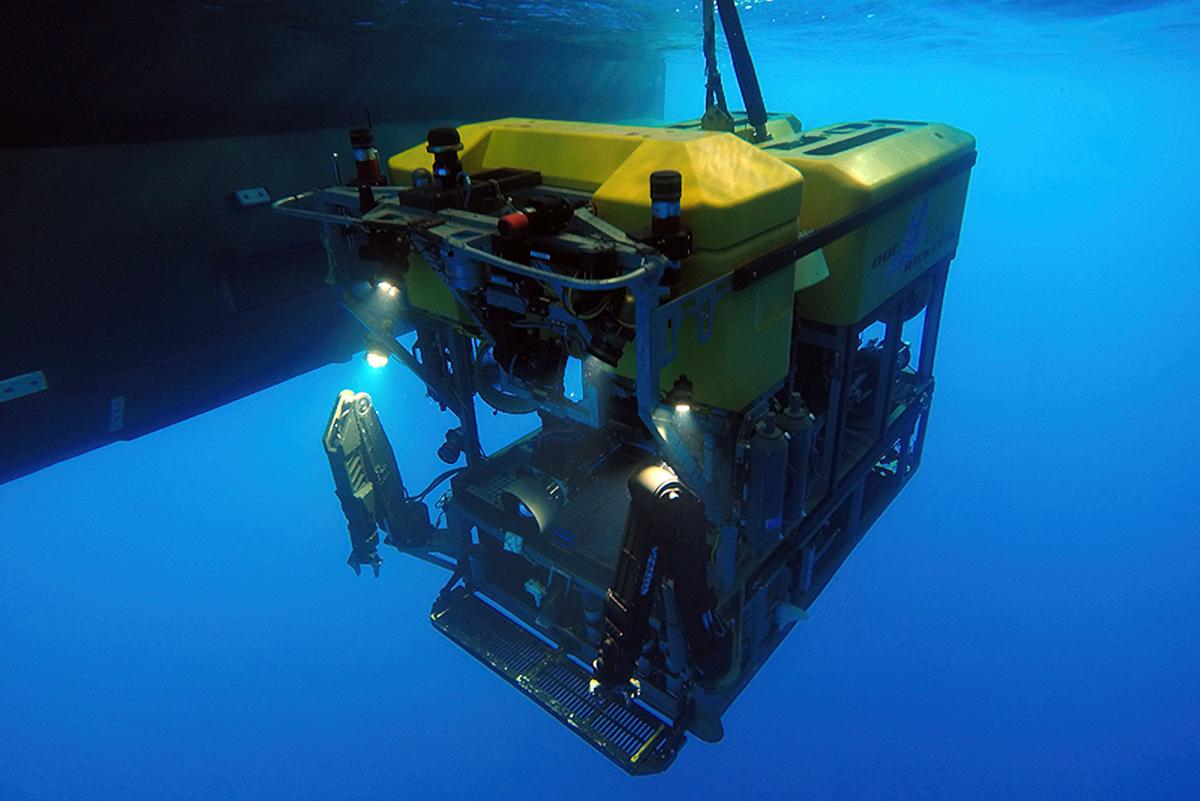 The ROV Doc Ricketts beneath the twin hulls of the research vessel Western Flyer. Operated by a team of scientists and pilots aboard a research vessel at the surface, MBARI’s ROV Doc Ricketts is a robotic submersible equipped with advanced cameras and scientific instruments for exploring the ocean’s midnight zone and abyssal seafloor.