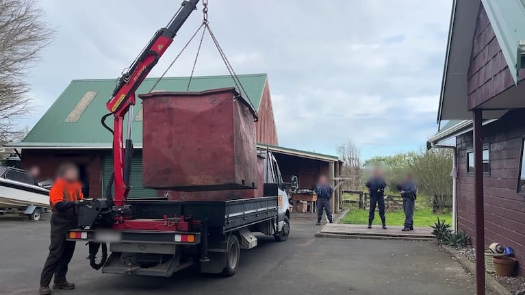 Some of the destroyed cannabis is loaded onto a truck.