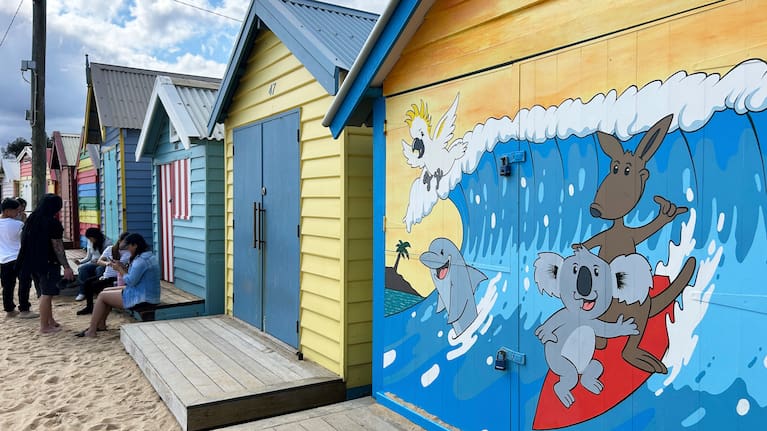 Visitors take photos by the Bathing boxes at Brighton Beach in Melbourne, Australia, Saturday, Sept. 13, 2025