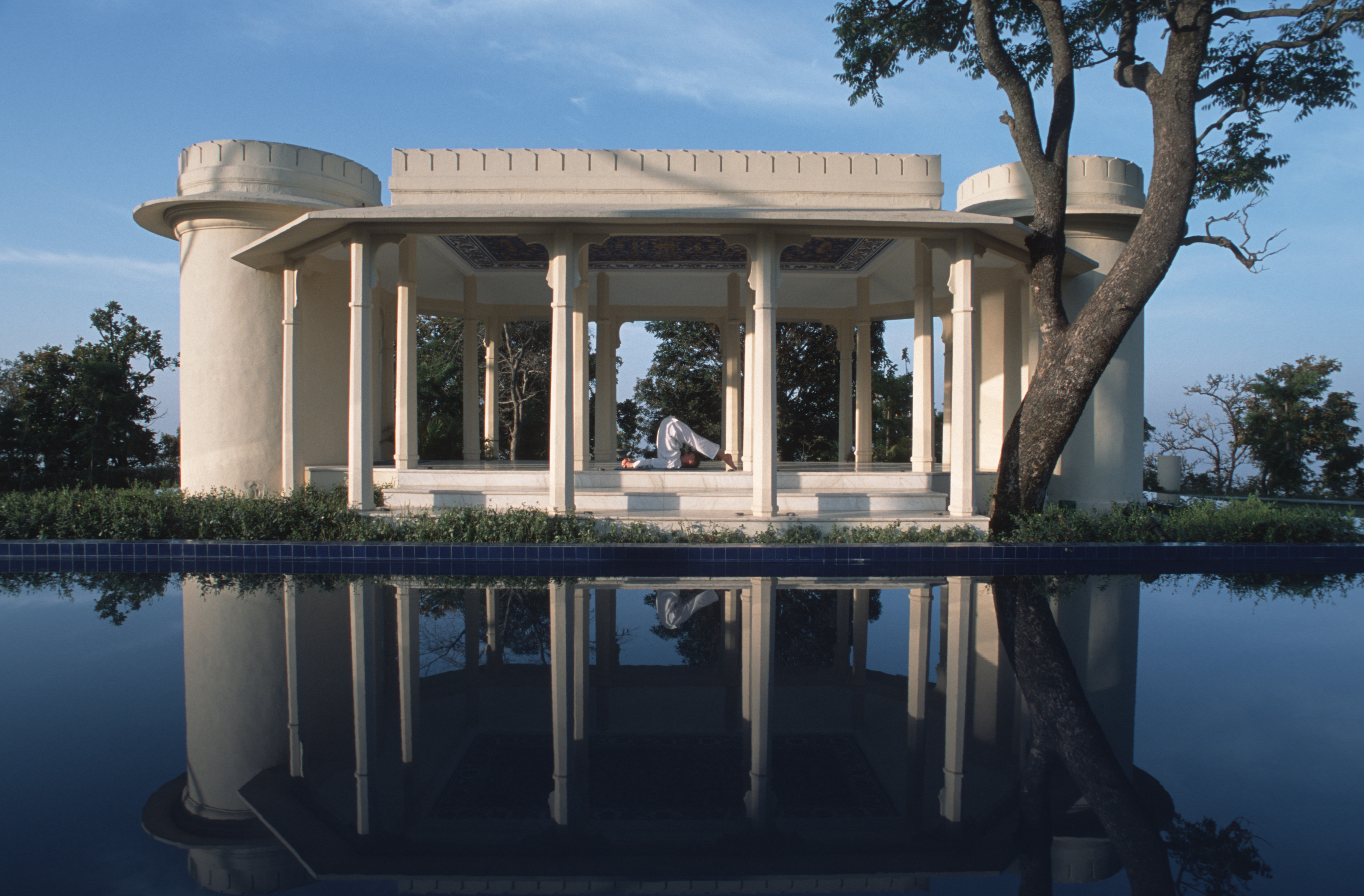 A person practicing yoga at Ananda in the Himalayas, a luxury destination spa resort.