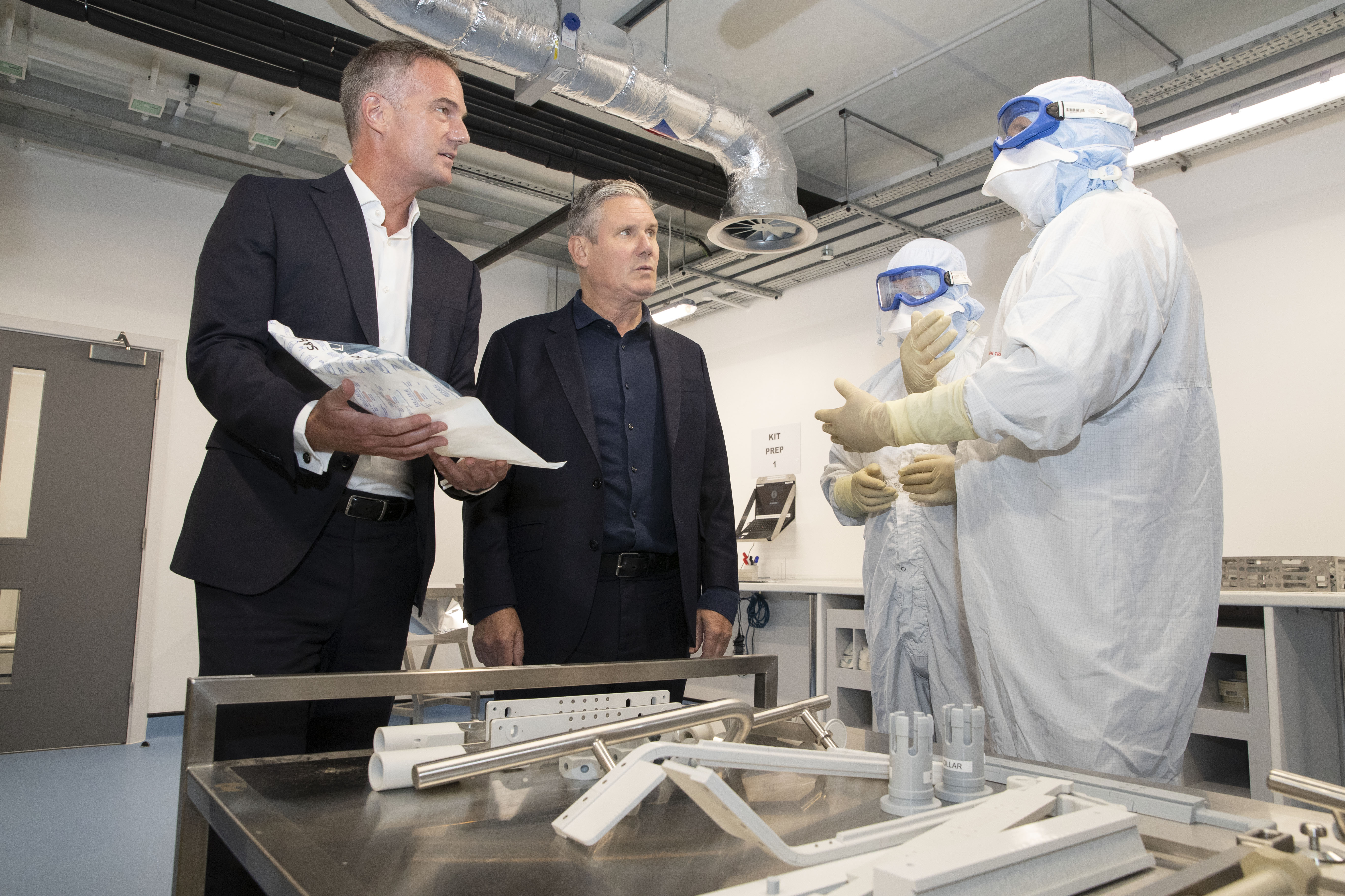 Keir Starmer and Peter Kyle talk with AstraZeneca employees at the Macclesfield site.