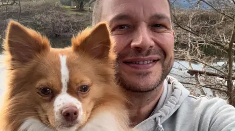 Gino Parisi Gino Parisi and his dog pictured alongside the river Usk.  