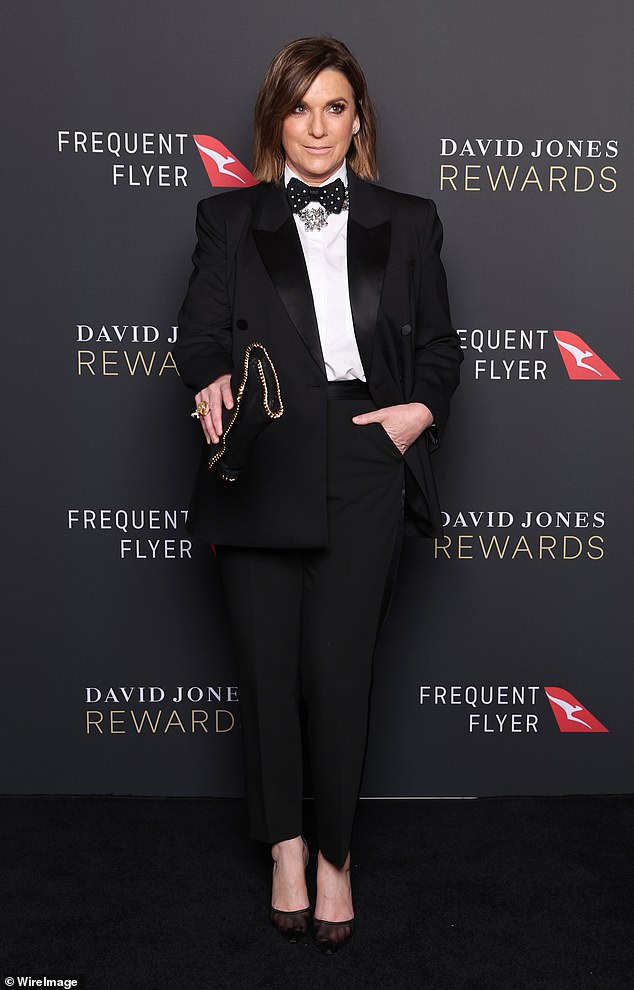 Also at the event was Kylie Gillies (pictured), who arrived in a tailored suit
