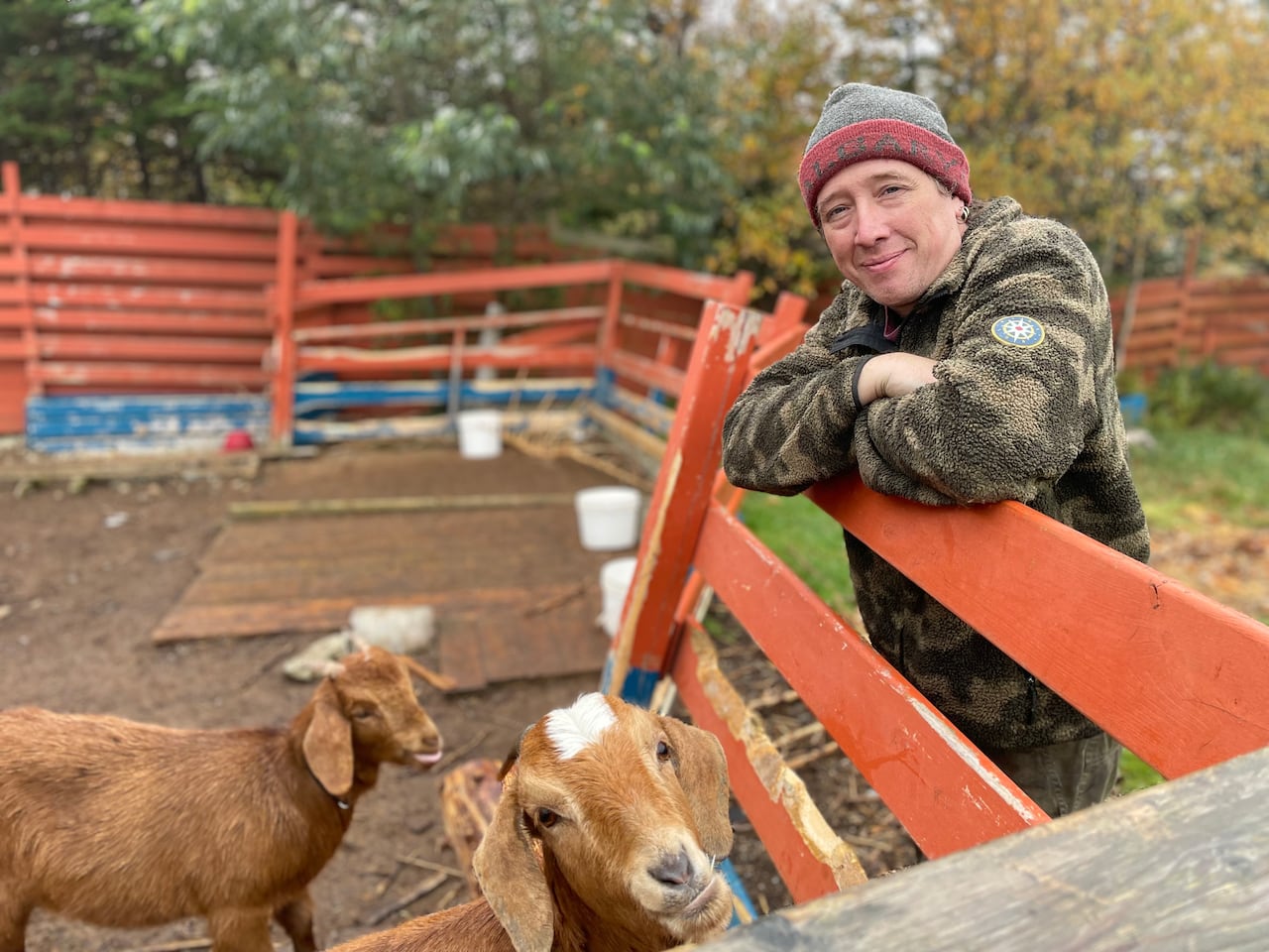 A man with two goats.
