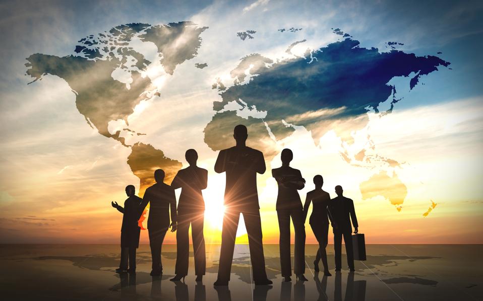 A silhouette of a team of businesspeople standing