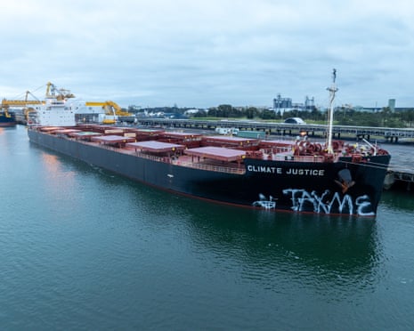 This morning in Muloobinba / Newcastle, members of Rising Tide painted “TAX ME” on a coal ship named Climate Justice.