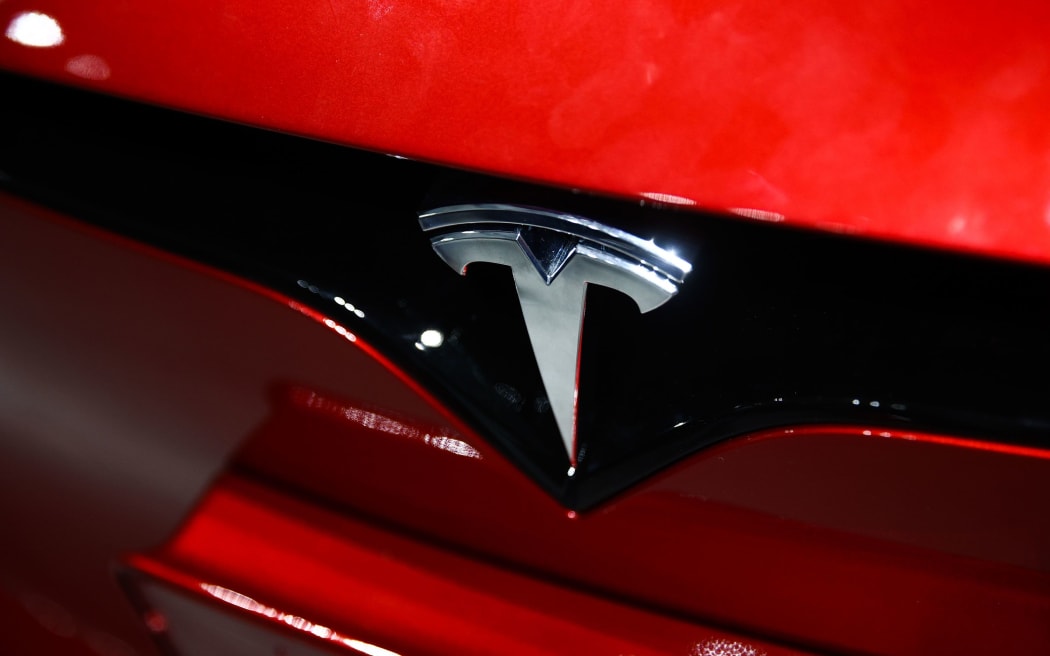 The Tesla logo is on a car at the Santa Monica, California, showroom. Tesla reported a sharp drop in revenue and earnings in the first quarter on April 22.