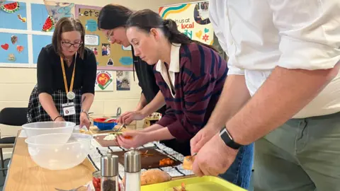 BBC/PHIL BODMER Adults and are invited and encouraged to get 'hands on' using simple recipes for nutritious meals 