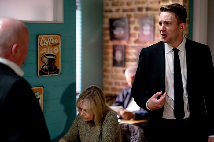 Callum looking angry and emotional as he defends himself to the Mitchells and Kathy in EastEnders