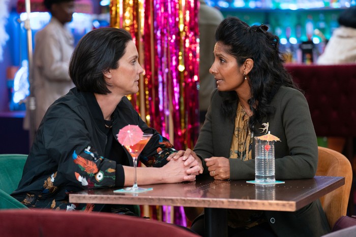 Eve and Suki sitting with drinks in The Albert in EastEnders