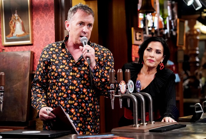 532767,TITLE:Eastenders Alfie speaking into a microphone with Kat next to him ion EastEnders