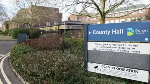 Google Dorset Council blue and white sign taken outside County Hall.