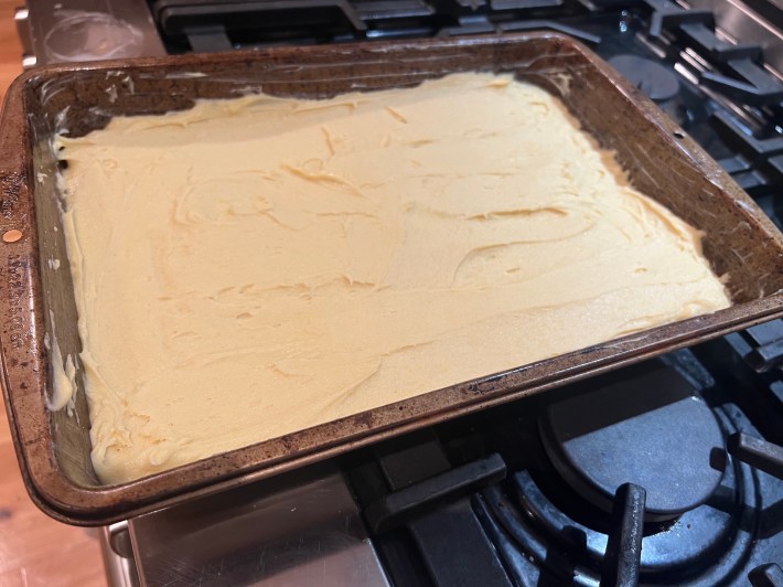 Cake batter smushed into a tin.