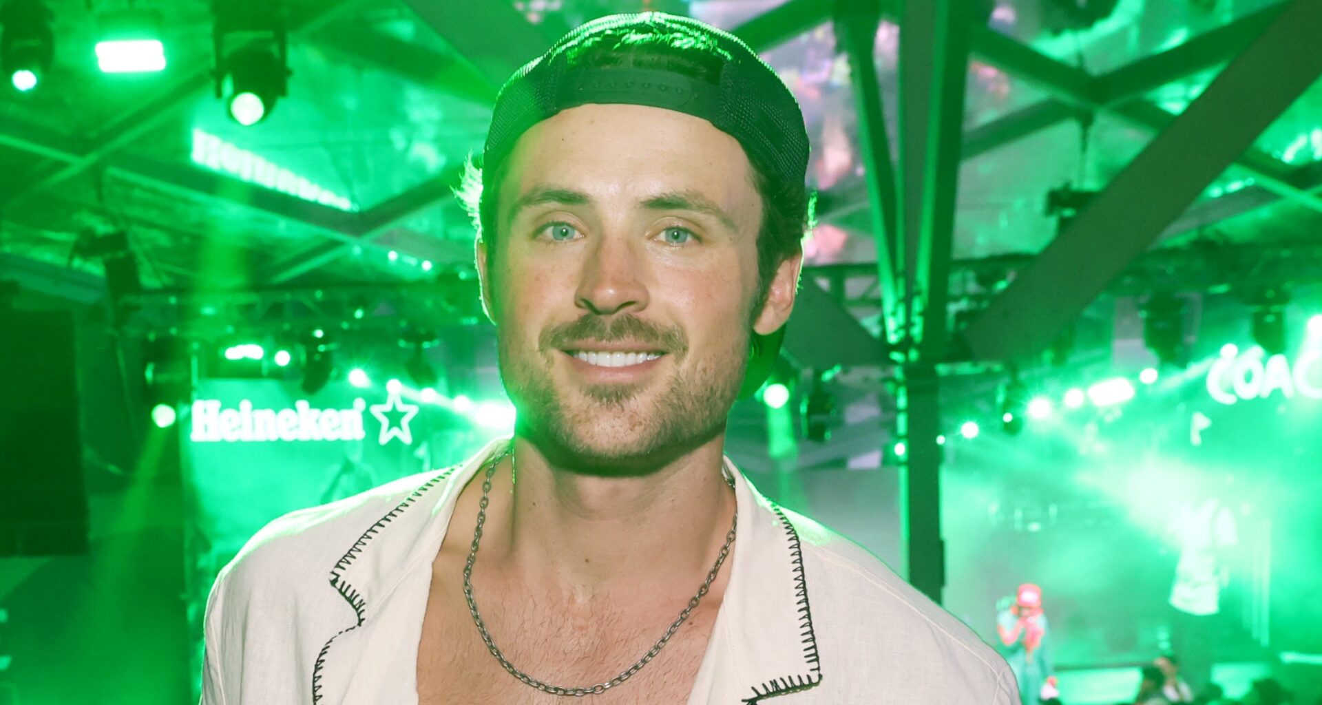 Dylan Efron smiling at an event