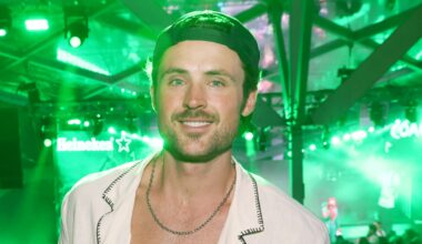 Dylan Efron smiling at an event