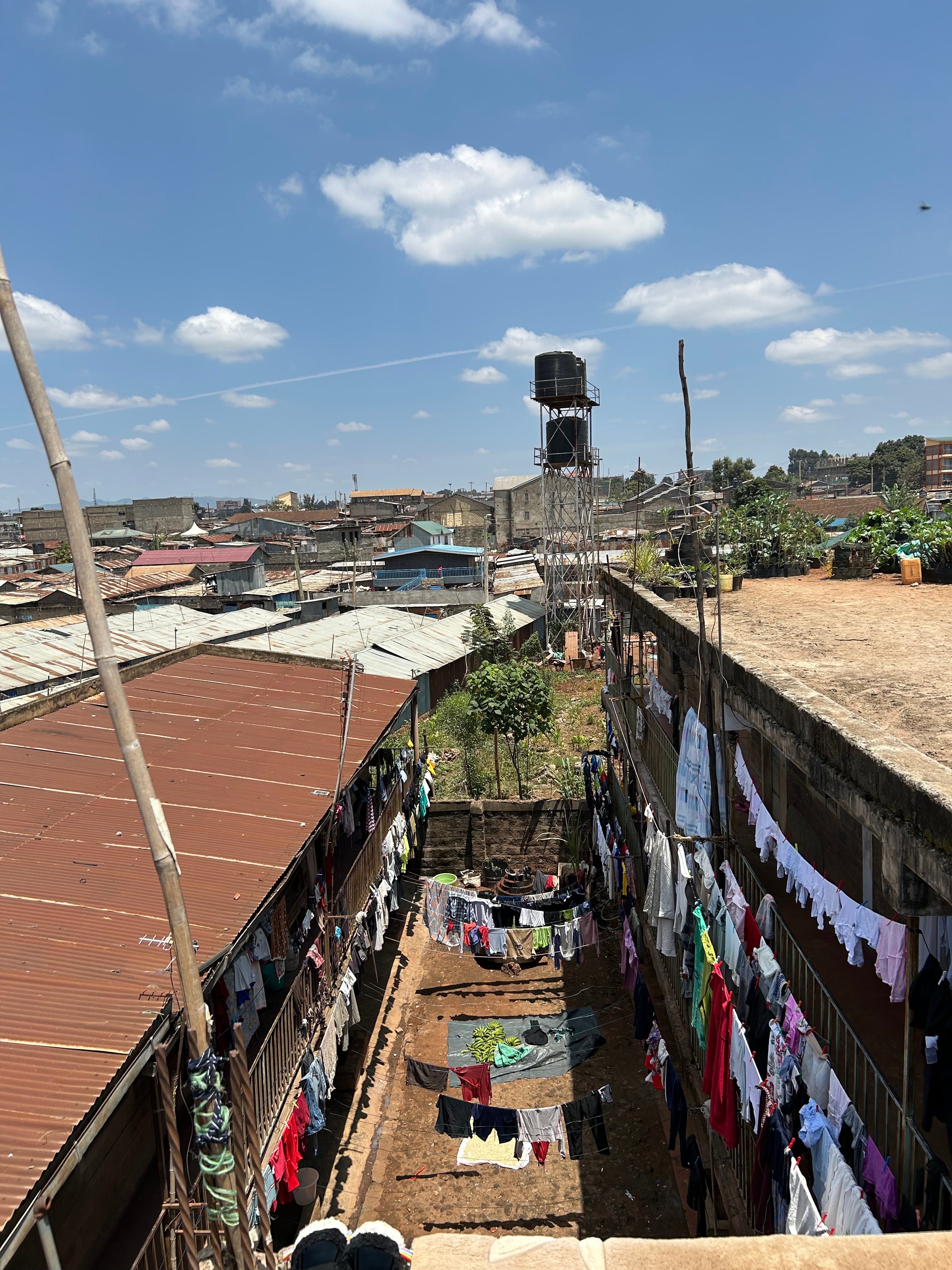 The vast number of colourful garments on display on laundry day give an indication of just how many people live in Jen’s block
