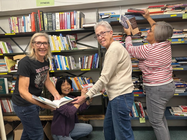 group of women working at book sale