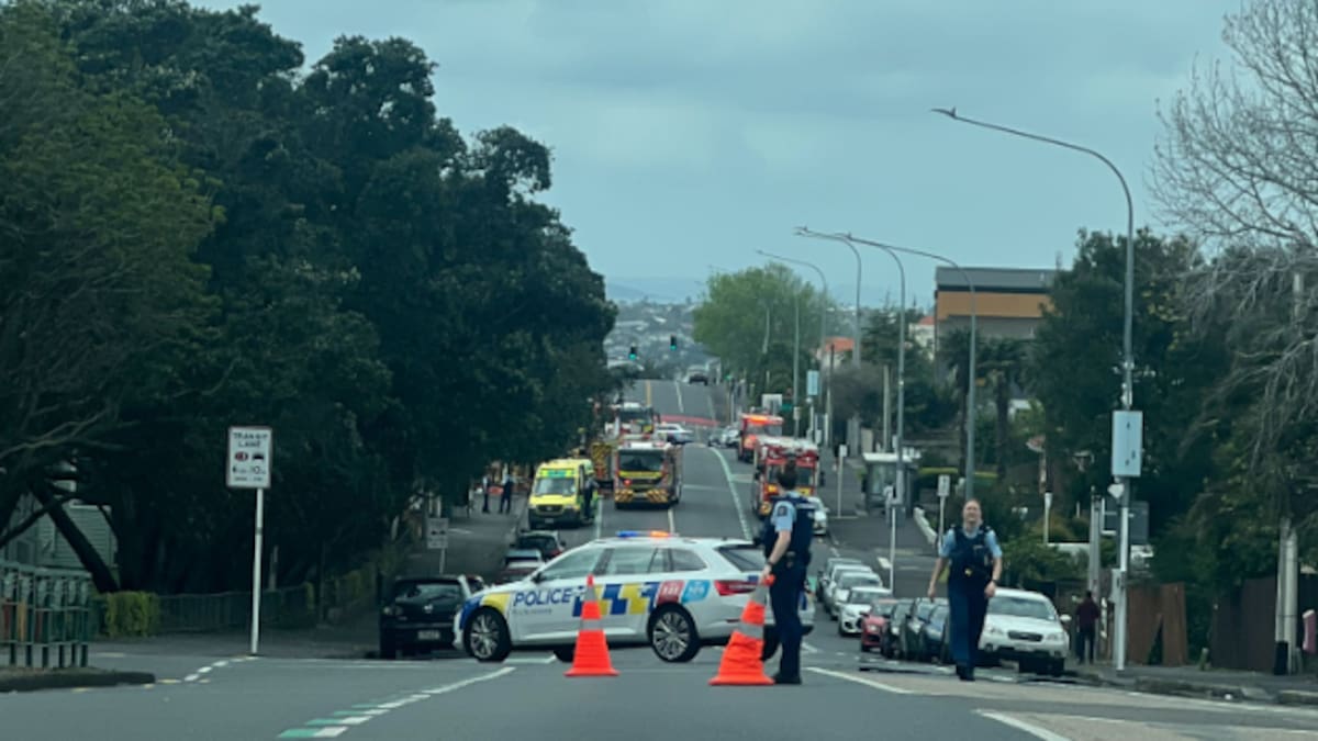 One injured as firefighters battle Northcote house fire, section of Onewa Rd closed