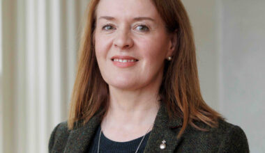 Woman with long hair dressed in black